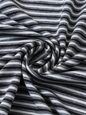 Close-up of black stripe sport fit stripe polo fabric showing crisp horizontal stripes and smooth, breathable texture.