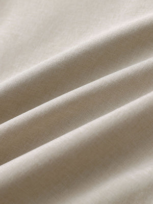 Close-up of cream heather performance golf shorts fabric showing breathable texture.