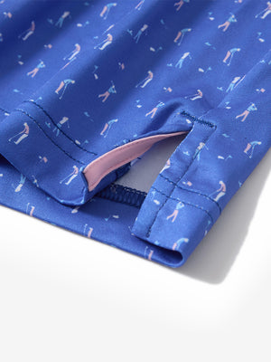 Close-up of the hem vent on the blue golf swing 4 way stretch print collared polo shirt, showing the side split for movement
