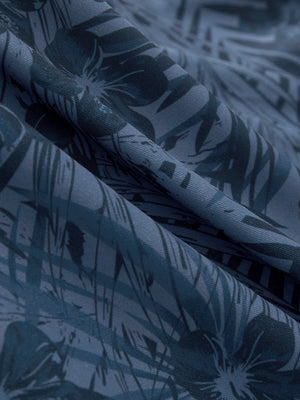 Close-up of dark blue plant stretch printed collarless henley golf shirts, showcasing texture and print details.