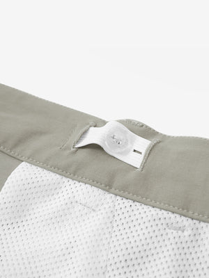 Interior shot of the waistband on the khaki grey youth water resistant cotton blend golf pants, showing inner construction
