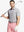 Front half-body shot of model holding golf club wearing Ventilated Heather Jacquard Polo – FADED DENIM HEATHER