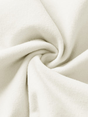 Fabric close-up of beige boys stretch fleece lined casual golf pants, soft stretch fabric with warm fleece lining.