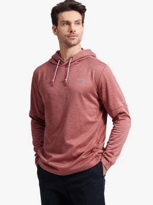 Half-body front shot of model styled in Brick Heather Classic Heather Fleece Hoodie, relaxed fit look