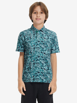 Front half-body shot of youth in dark green leaf performance print boys golf polo, highlighting design and fit