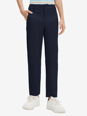 Front lower body shot of model wearing the navy youth water resistant cotton blend golf pants, showcasing a relaxed fit