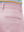 Close-up of the back pocket detail on the pink youth water resistant cotton blend golf pants, emphasizing storage