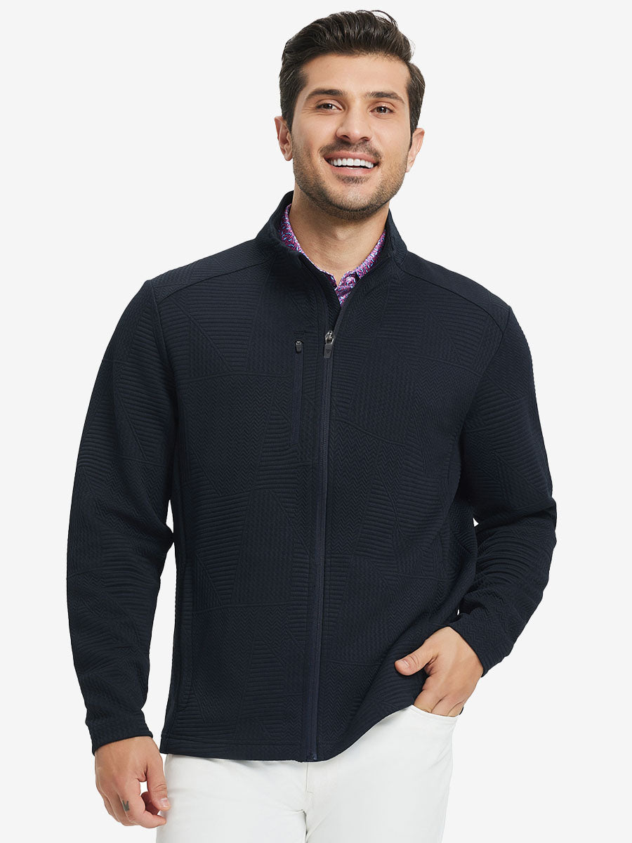 Model front half body lifting jacket, hand in inner pocket, textured insulated winter jacket, navy.