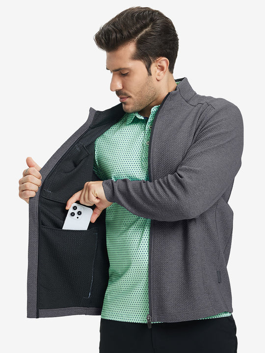 Model front half body lifting jacket, hand in inner pocket, textured insulated winter jacket, grey heather.