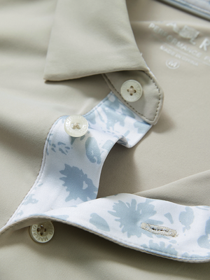 Detail of the collar opening on the oyster gray everyday classic solid polo, emphasizing the structured neckline design