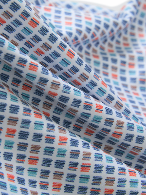 Close-up of colorful vertical stripe lightweight stretch upgraded print golf polo shirts, showcasing texture and print details.