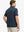 Rear half-body view of Modern Fit Melange Polo in NAVY HEATHER, showing clean fit and fabric details.